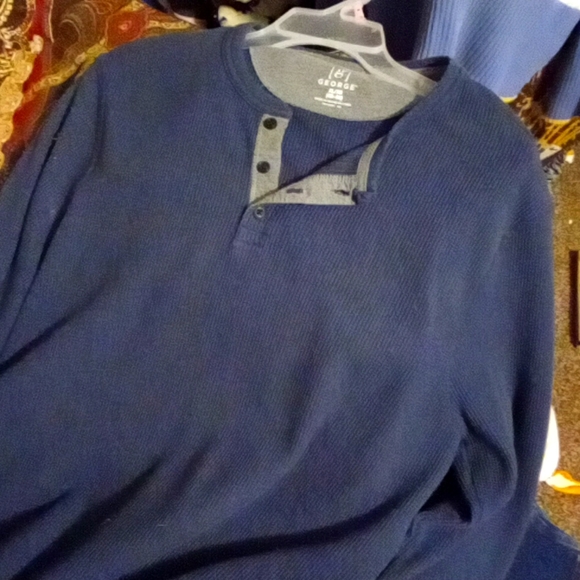 It is a long sleeve shirt dark blue it looks faded in the picture but they're no - Picture 2 of 2